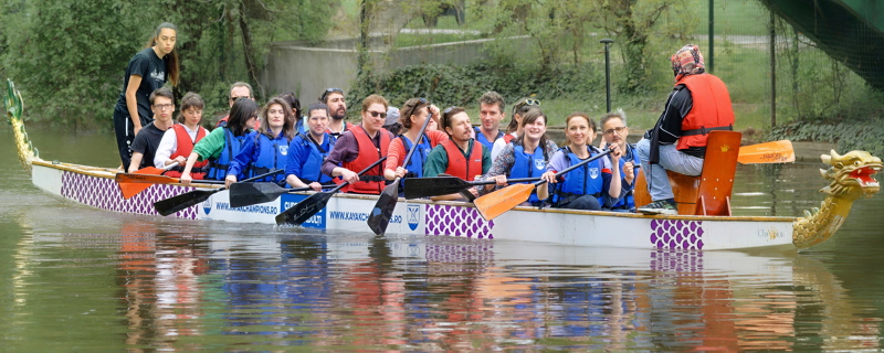 People rowing in a big kayak